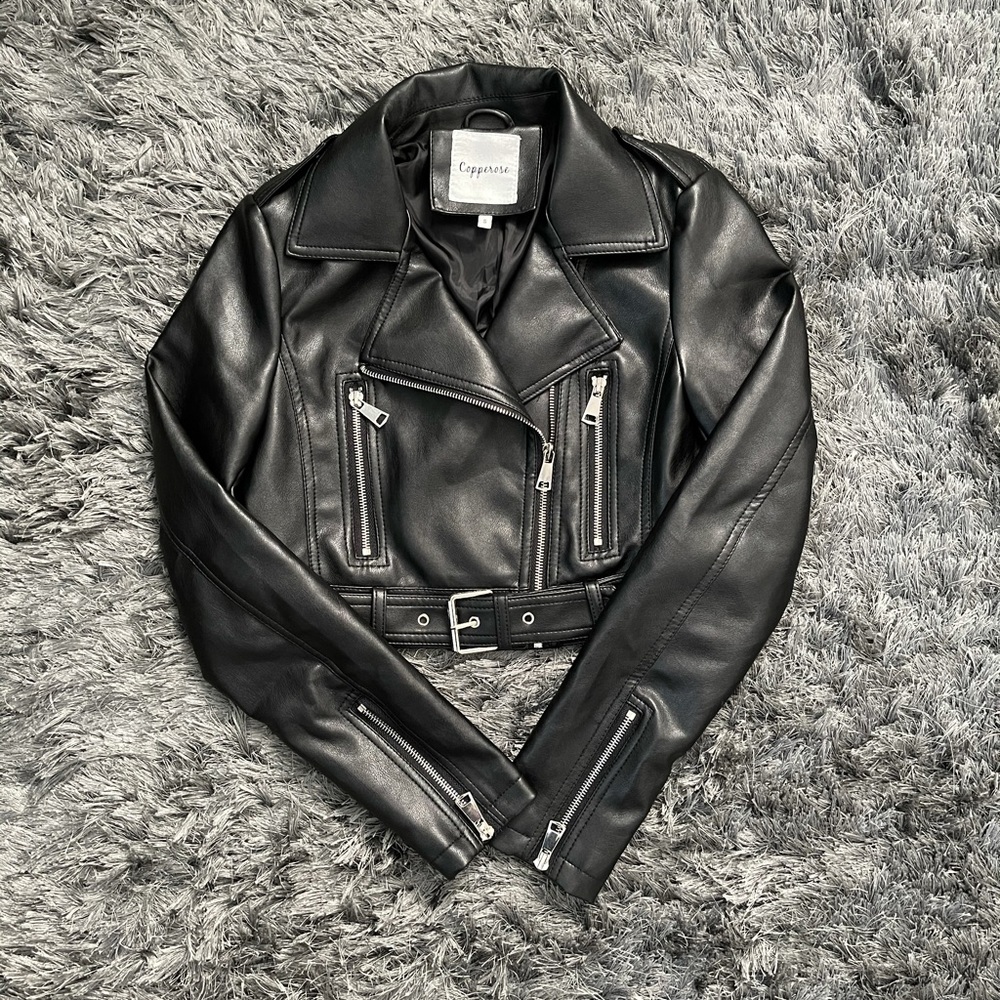 Black cropped faux leather jacket.